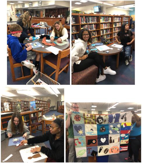 students sitting in library working on the identity quilt project
